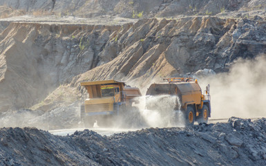 quarry dumptruck working in a coal mine in the transportation of rocks