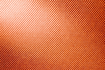 orange fabric nylon background texture with light from corner