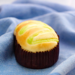 Bun with green custard fill on top