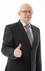 Portrait of a mature businessman offering handshake