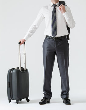 Unrecognizable businessman with a suitcase