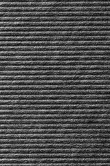 Close up black color corrugated paper texture