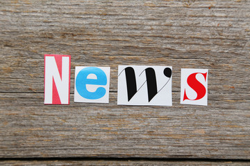Fototapeta premium The word News in cut out magazine letters