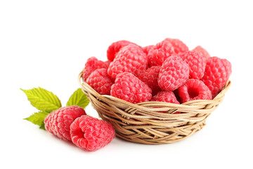 Red raspberry in basket isolated on a white