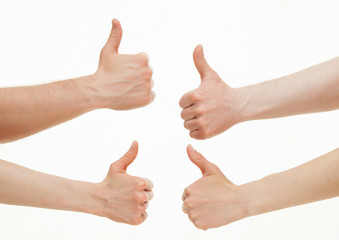 Four hands showing  thumb up signs