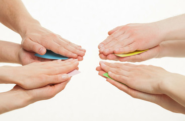 Several people hiding cards