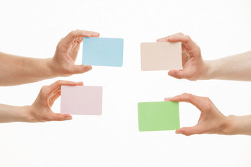 Obraz premium Human hands holding colorful paper cards