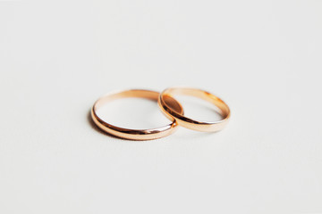 Two golden rings on white background