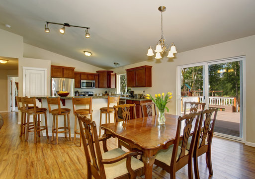 perfect dinning room with hardwood floor, and nice table chair s