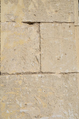 Old floor small tiles beige stone pavement
