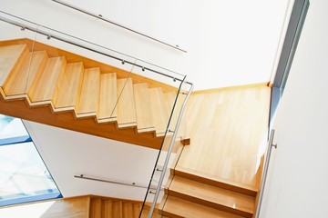 Obraz na płótnie Canvas Modern architecture interior with wooden stairs