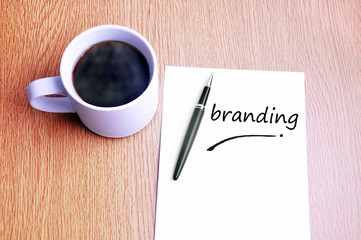 Coffee, pen and notes write branding
