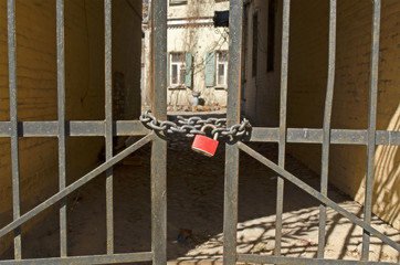 Red lock on gates to backyard