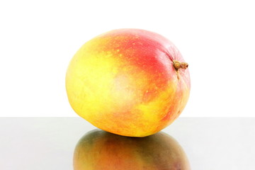 ripe mango fruit with shedow in pure white background