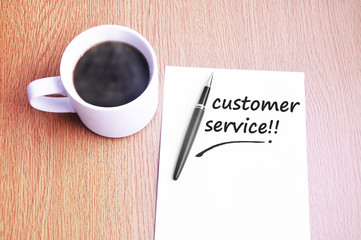 Coffee, pen and notes write customer service