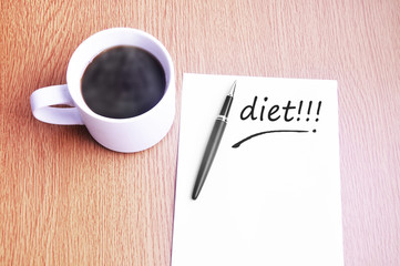 Coffee, pen and notes write diet