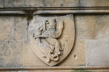 italy, milan, coat of arms in white marble, dragon and bird