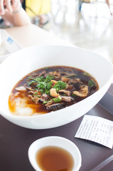 mixed pork meat with sticky rice noodle in offal soup