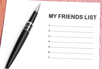 Pen  and notes paper with my friends list