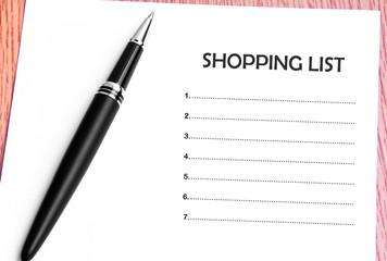 Pen  and notes paper with shopping list