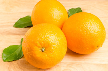 Fresh Navel orange fruit on wooden background,healthy food