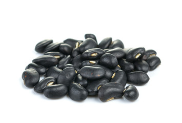 Dry black bean closeup on white background