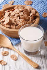 Fitness Breakfast: bran flakes and milk close-up. Vertical
