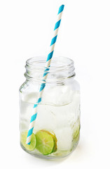 Lemonade ice, lemon slices in a jar with straw