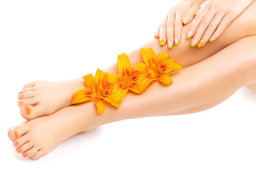 pedicure and manicure with a orange lily flower