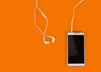 white earphones for using with digital music or  smart phone