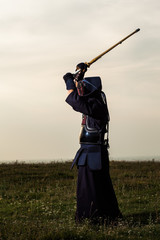 Kendo fighter with shinai