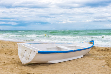 White boat on the seashore