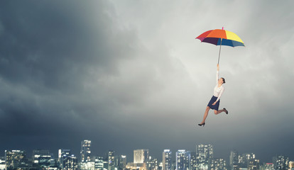 Woman fly on umbrella
