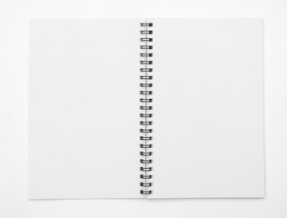 Blank spiral notebook isolated on white background