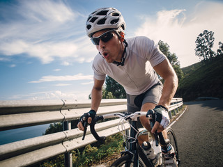 Cyclist in maximum effort in a road
