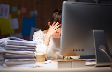 Young and beautiful businesswoman tired from work in the office