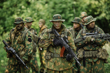 Group of soldiers special forces during the raid in the forest