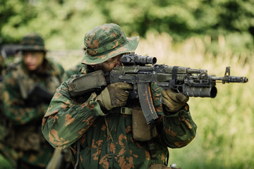 Group of soldiers special forces during the raid in the forest