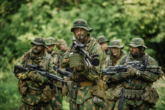 Group of soldiers special forces during the raid in the forest