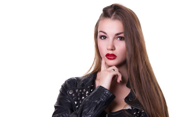 Beautiful girl with a red lipstick dressed in a black leather jacket. Isolated over white background.  Copy space.