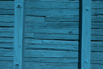 Beautiful blue / green wooden facade of a cabin (background, wallpaper)