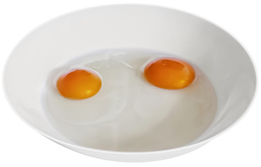 Two Hen Egg Yolks In White Porcelain Plate On White Background, Isolated with Clipping Path.