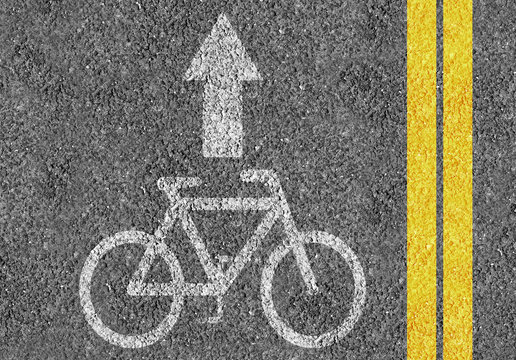 Road with bicycle lane mark and two yellow lines