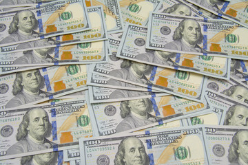One hundred dollars pile as background