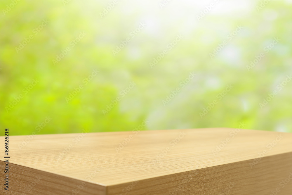 Poster empty wooden table and green natural spring blur bokeh backgroun