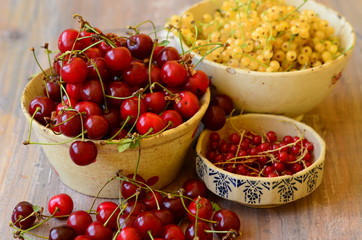 Cherries and currants in vintage bowls