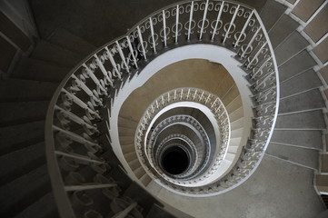 Spiral staircase in a building with many levels