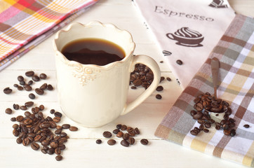 Ceramic mug of coffee on a white wooden table in Provence style