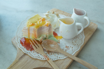 Rainbow Crepe Cake on the marble table 