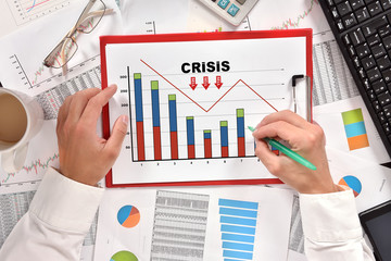 businessman drawing crisis chart